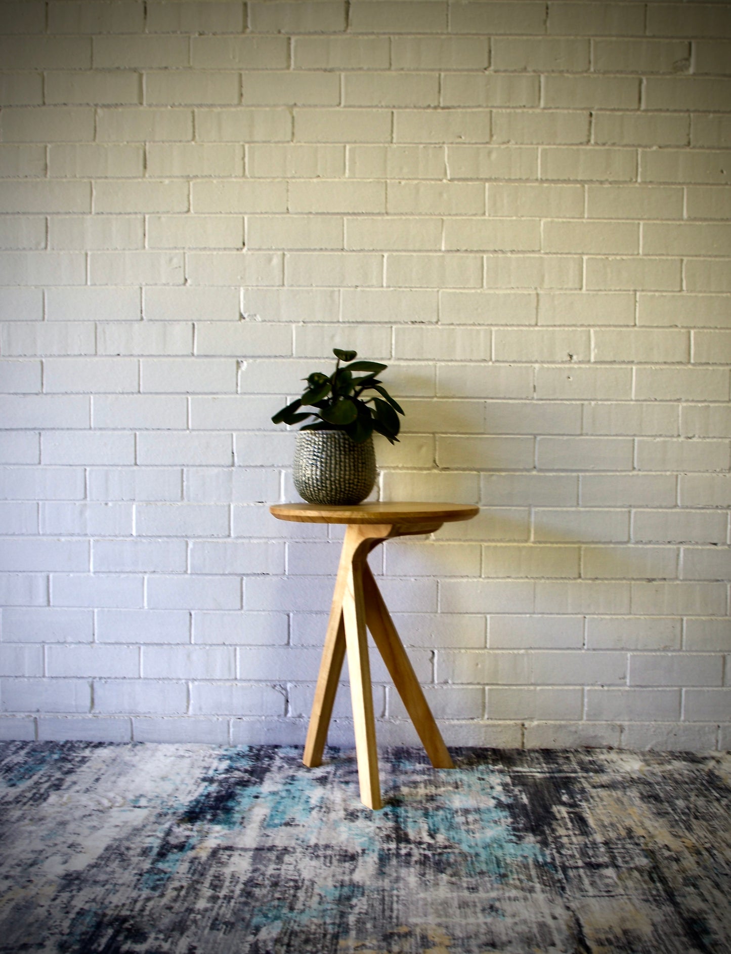 The Beppu Side Table is a modern statement piece. Crafted from sustainable white cedar with stylish 3-legs and round top. Colour Natural. Measures 450 diameter X 600 height. Front Styled.