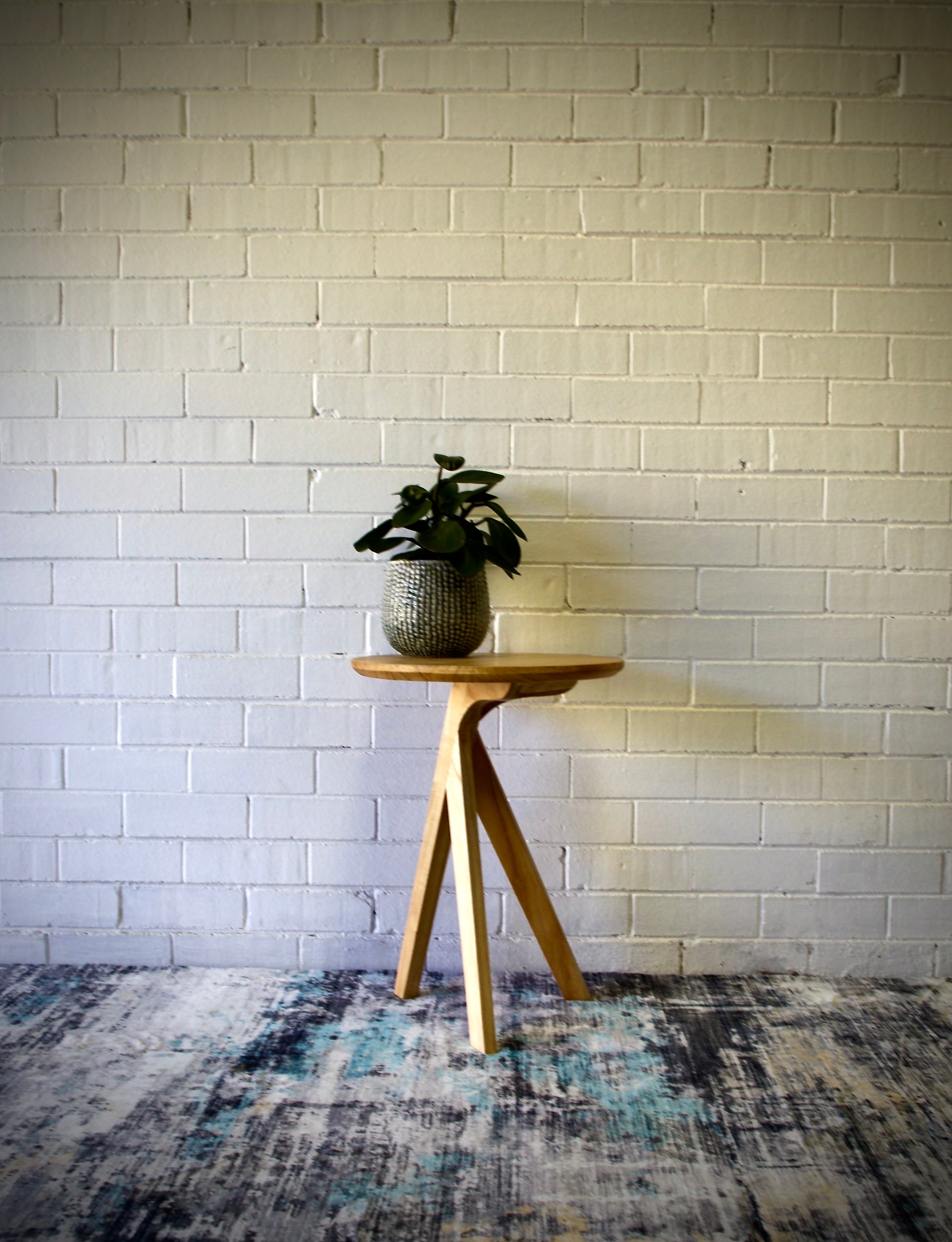 The Beppu Side Table is a modern statement piece. Crafted from sustainable white cedar with stylish 3-legs and round top. Colour Natural. Measures 450 diameter X 600 height. Front Styled.
