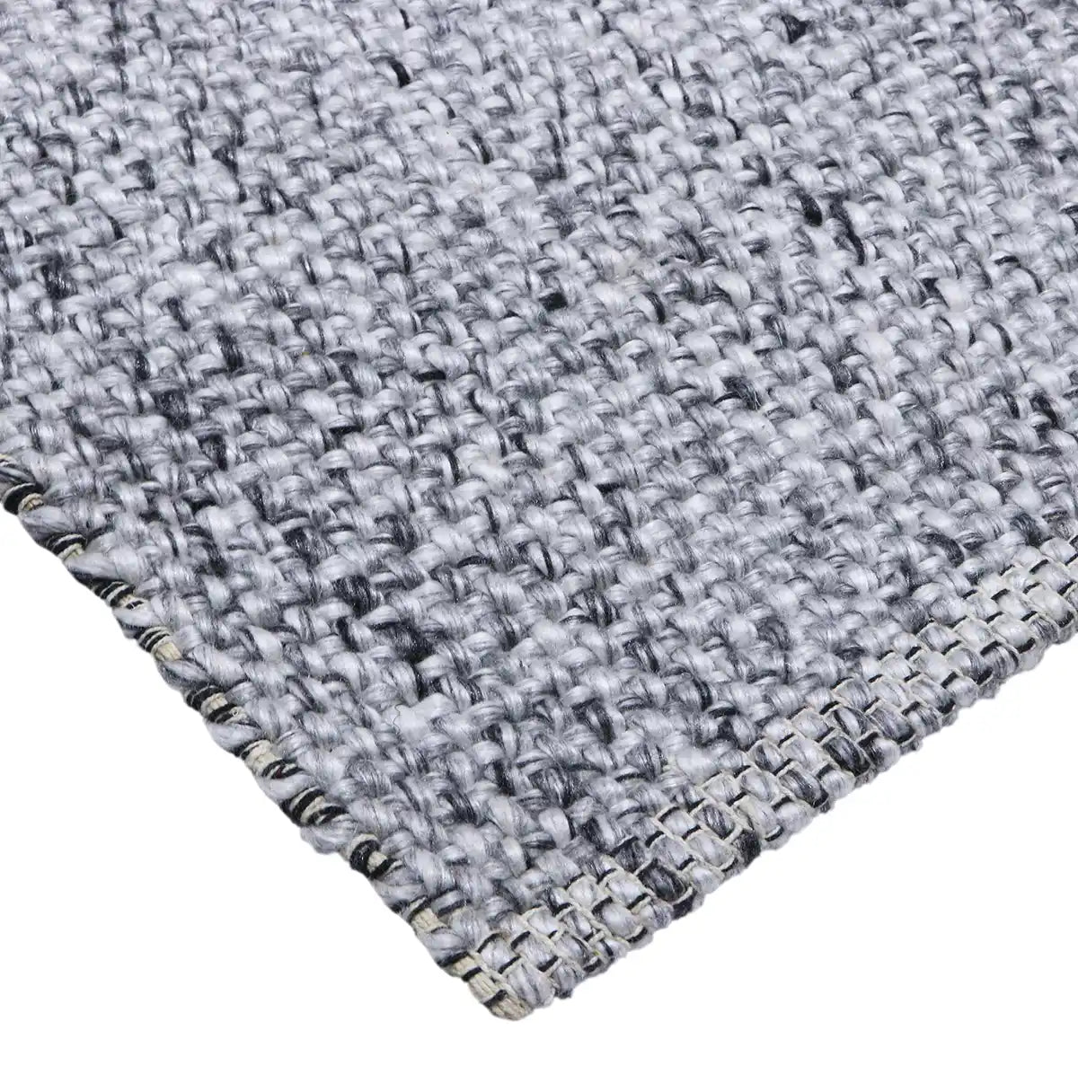 Pacific Black is a handwoven wool and polyester rug with a low-textured cross weave. It boasts a soft pile height of 7-9mm. Colour Black and White. Sizes 160 X 230, 200 X 290, 240 X 340 and 300 X 400. Corner.