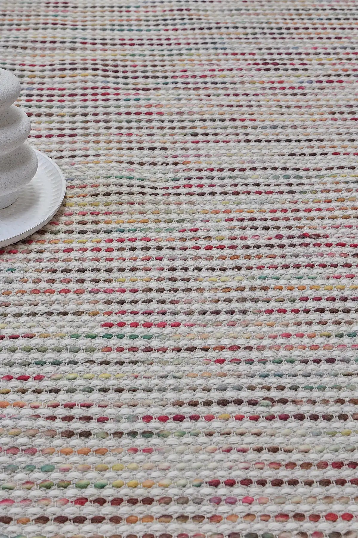 Boa - Petal is a hand-woven flatweave, made of wool with a pile height of 7-9mm. Colours Cream with Multi coloured accents. Sizes 160 X 230, 200 X 290, and 240 X 340. Life.