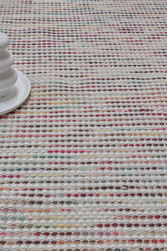 Boa - Petal is a hand-woven flatweave, made of wool with a pile height of 7-9mm. Colours Cream with Multi coloured accents. Sizes 160 X 230, 200 X 290, and 240 X 340. Life.