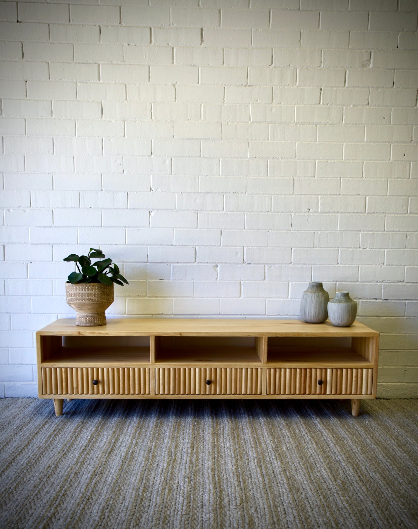 The Brando 3 Drawer Natural Entertainment Unit is a modern/contemporary designed piece. It has 3 textured drawers and 3 open shelves. Crafted from sustainable white cedar. Colour natural. Measures 1500 length X 400 depth X 400 height. Front Styled.