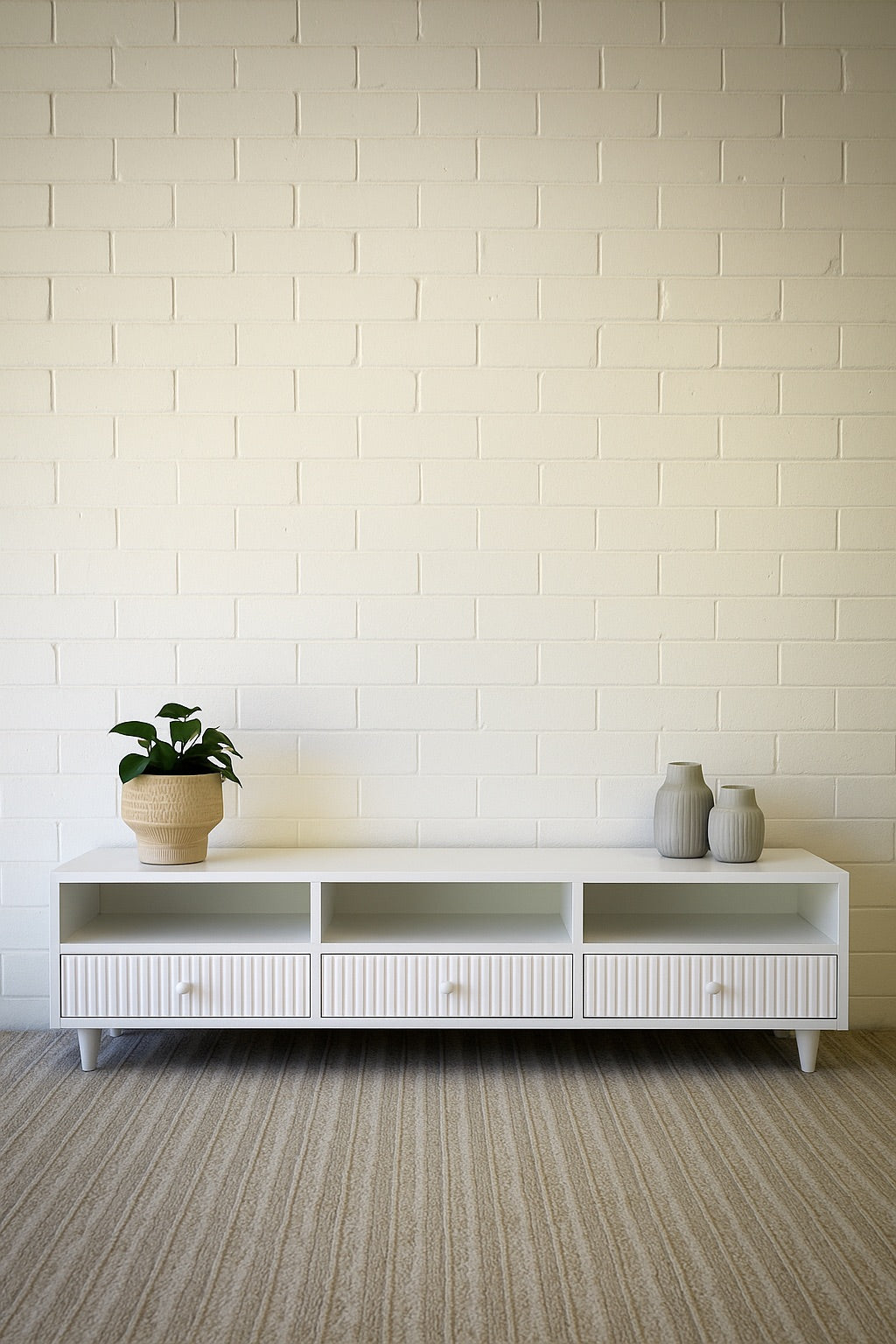 The Brando 3 Drawer White Entertainment Unit is a modern/contemporary designed piece. It has 3 textured drawers and 3 open shelves. Crafted from sustainable white cedar. Colour white. Measures 1500 length X 400 depth X 400 height. Styled.