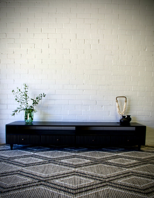 The Brando 4 Drawer Black Entertainment Unit is a modern/contemporary designed piece. It has 4 textured drawers and 2 open shelves. Crafted from sustainable white cedar. Colour black. Measures 2100 length X 400 depth X 400 height. Front Styled.