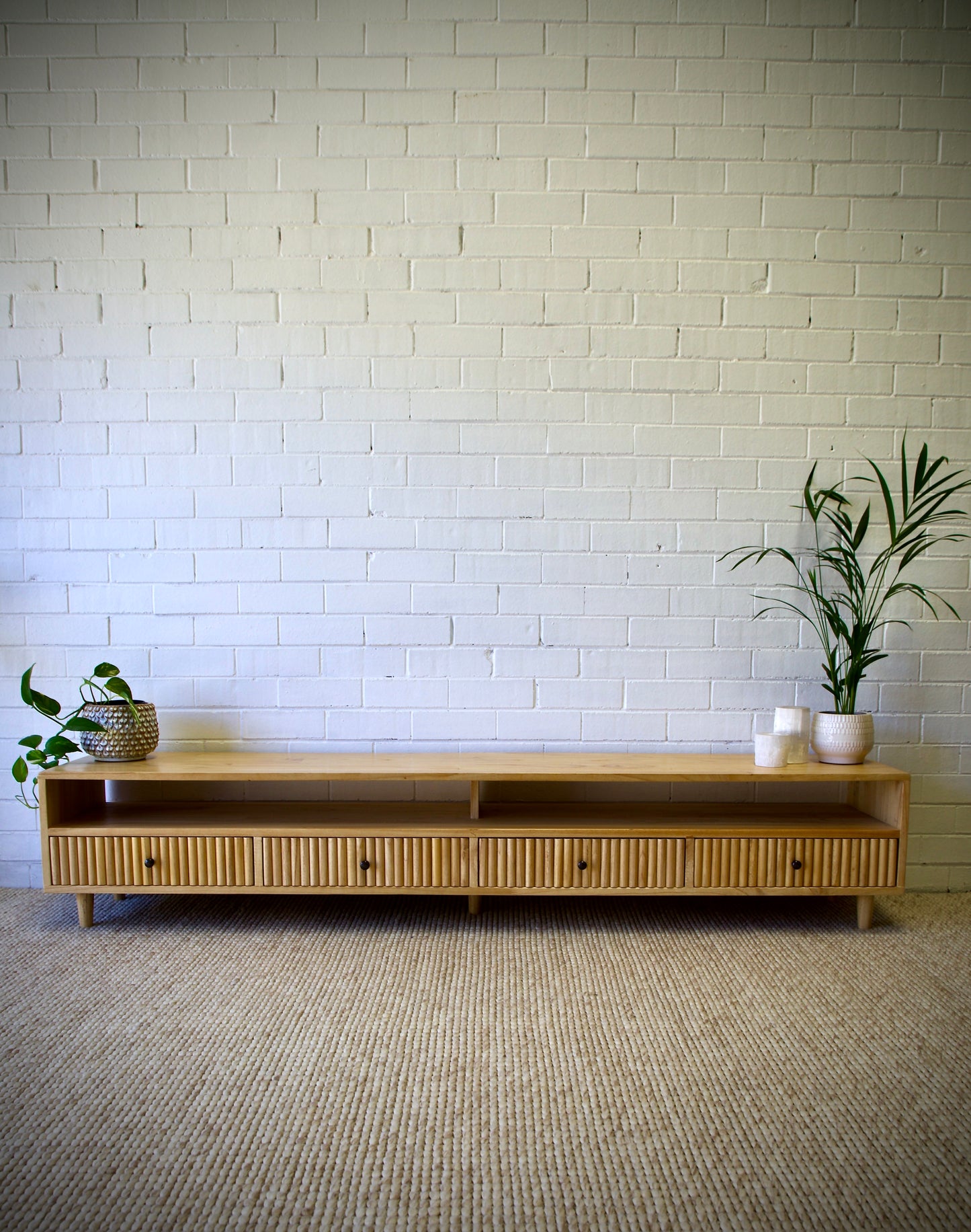 The Brando 4 Drawer Natural Entertainment Unit is a modern/contemporary designed piece. It has 4 textured drawers and 2 open shelves. Crafted from sustainable white cedar. Colour natural. Measures 2100 length X 400 depth X 400 height. Front Styled.