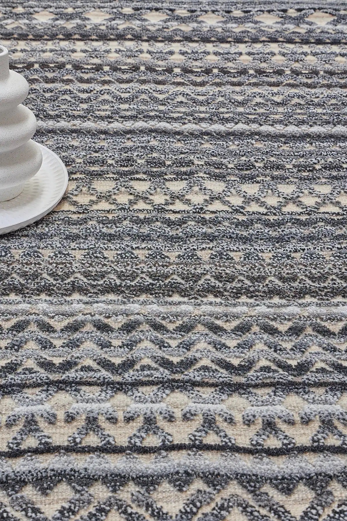 Brazil - Carbon is a Tribal Hand-Knotted Wool and Bamboo Silk Rug with a pile height of 7-9mm. Colours Dark Grey, Blues and Cream. Sizes 160 X 230, 200 X 290, and 240 X 340. Life.