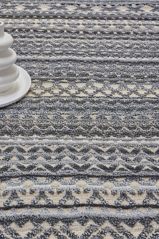 Brazil - Carbon is a Tribal Hand-Knotted Wool and Bamboo Silk Rug with a pile height of 7-9mm. Colours Dark Grey, Blues and Cream. Sizes 160 X 230, 200 X 290, and 240 X 340. Life.