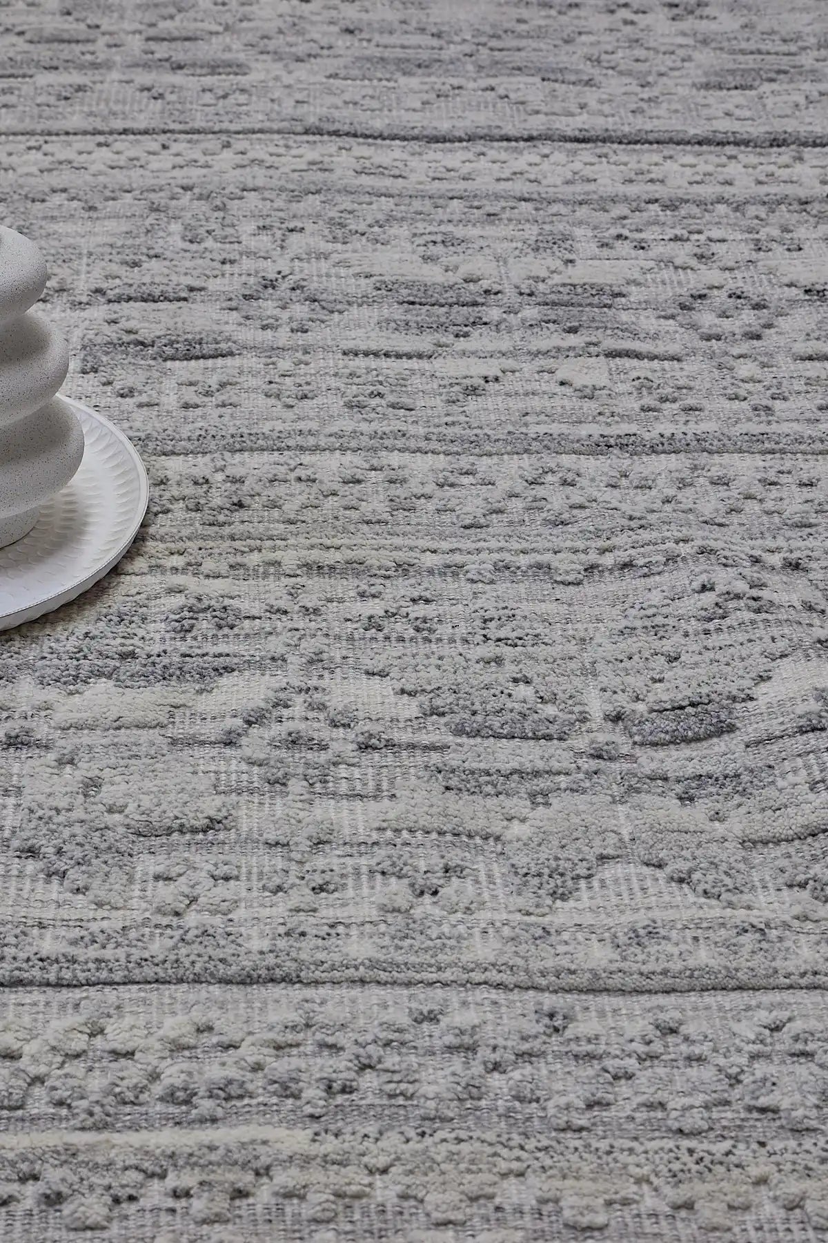 Brazil - Lilly is a Boho Tribal Hand-Knotted Wool and Bamboo Silk Rug with a pile height of 7-9mm. Colours White with Light Grey and Dark Grey accents. Sizes 160 X 230, 200 X 290, and 240 X 340. Life.
