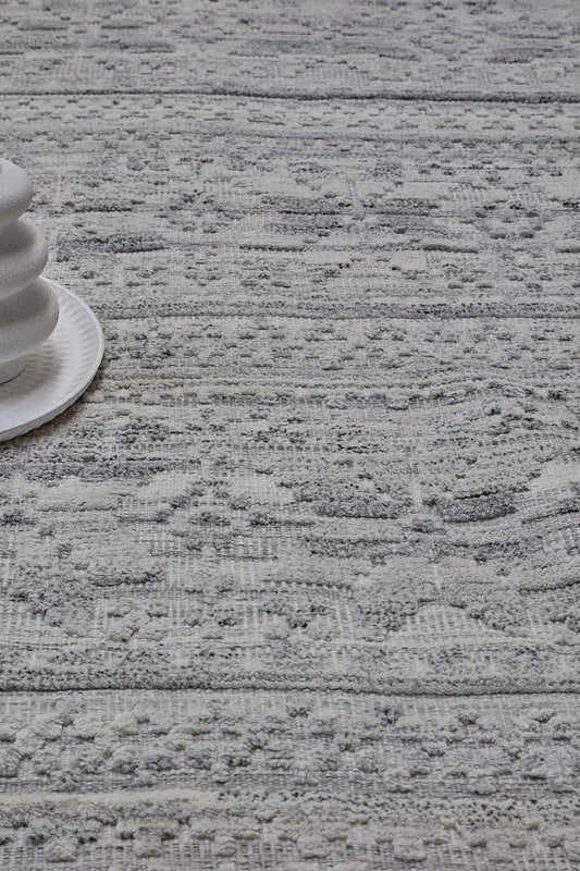 Brazil - Lilly is a Boho Tribal Hand-Knotted Wool and Bamboo Silk Rug with a pile height of 7-9mm. Colours White with Light Grey and Dark Grey accents. Sizes 160 X 230, 200 X 290, and 240 X 340. Life.