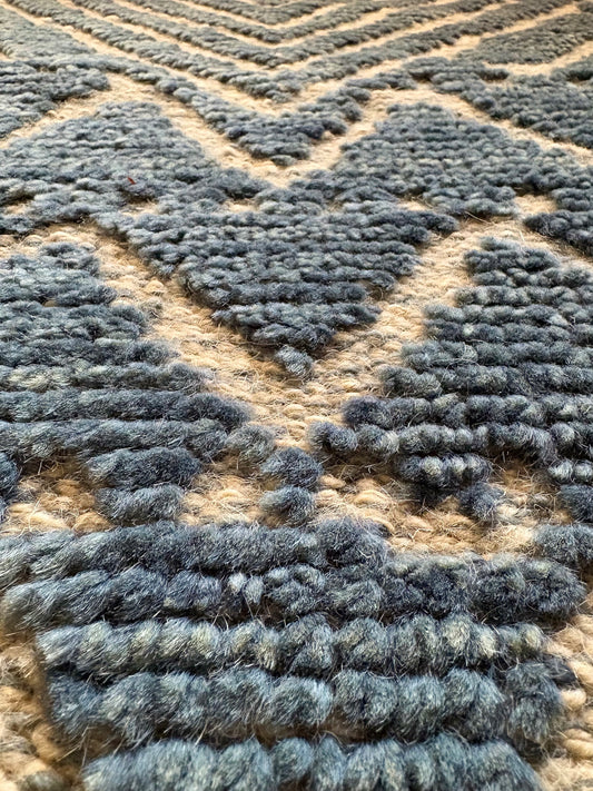 Brazil Sky modern hand-knotted rug in a wool and viscose blend with a geometric design and 7-9mm pile. Blue with light grey accents. Sizes 160 x 230, 200 x 290 and 240 x 340 cm. Super close angle view.