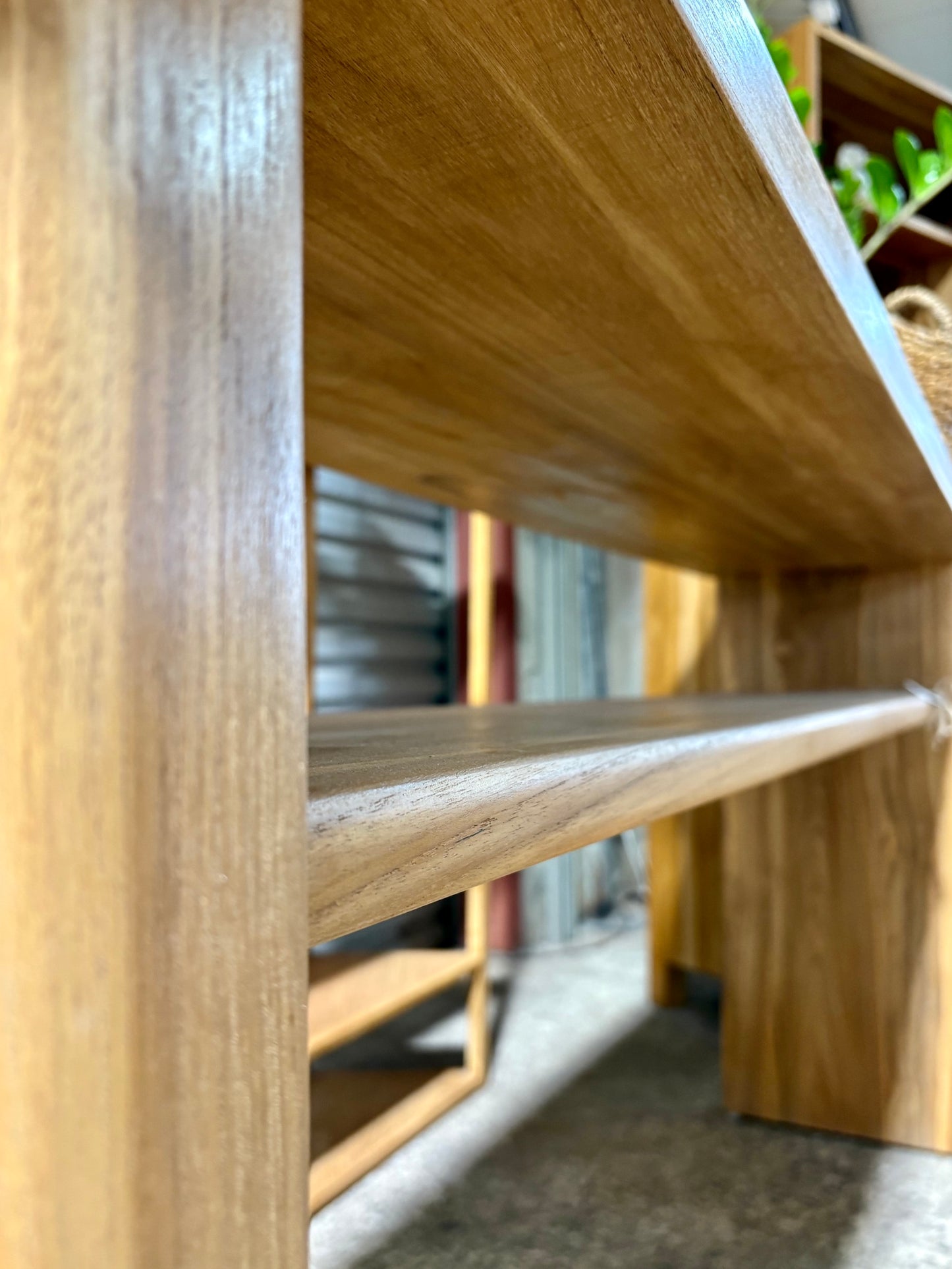 Budapest Console crafted from solid teak. Featuring  an added shelf, 2 solid legs and solid top with rounded ends. Colour Natural Teak. Measures 1800 Wide X 400 Depth X 800 Height. Under.