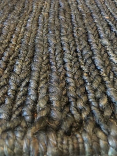 Byron Blue hand-woven hemp rug in a braided-style flatweave. Dark blue. Sizes 200 x 290 and 240 x 320 cm. Angle Close view.