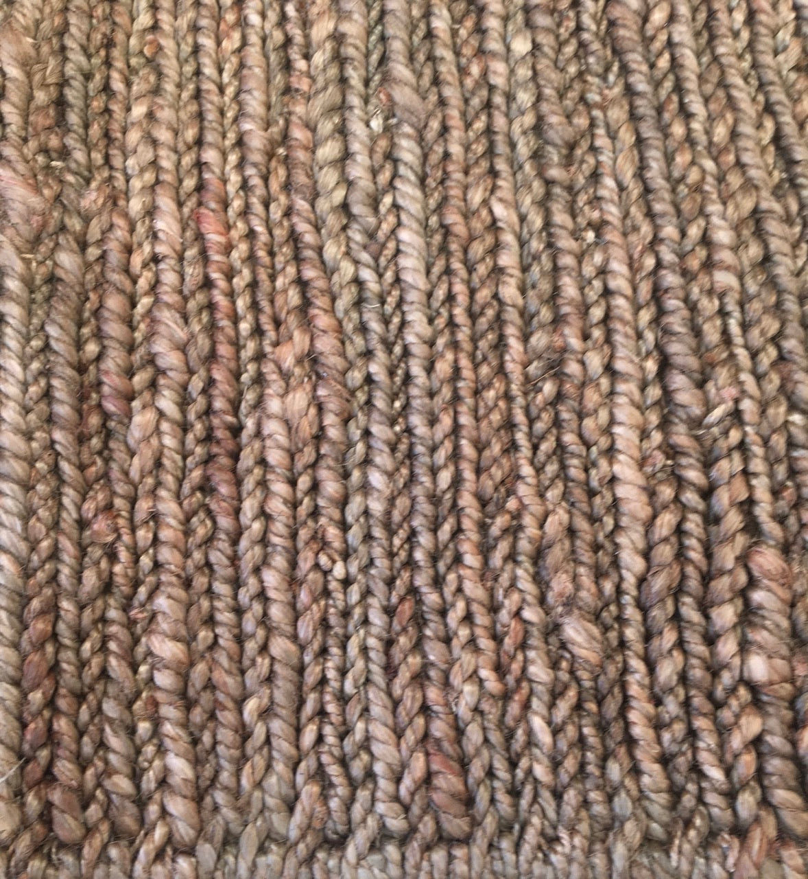 Byron Coffee hand-woven hemp rug in a braided-style flatweave. Brown. Sizes 155 x 225, 200 x 290 and 240 x 320 cm. Top close view.