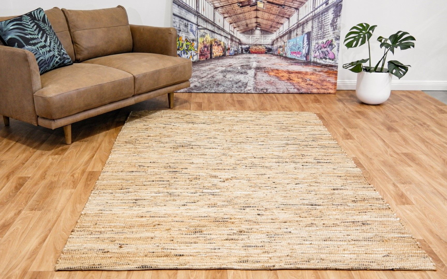 The Chief Natural Jute Rug. Hand woven from Jute fibres. Colour Natural. Sizes 155 X 225 and 200 X 290. Styled.
