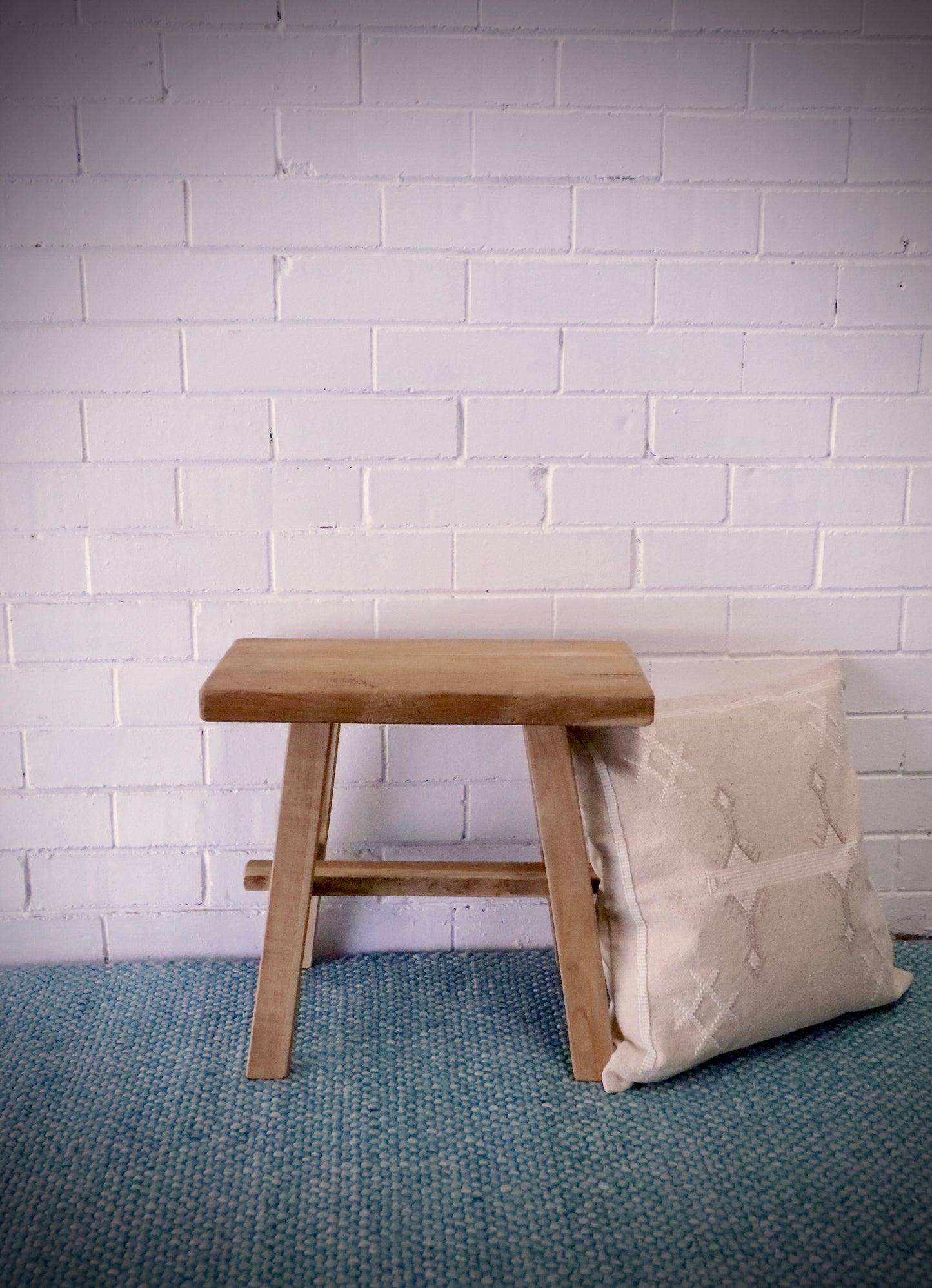 Chitose Rectangle Foot Stool. Handcrafted from durable, reclaimed teak, it adds a touch of rustic charm to any space and is built to last. Measures   500 Wide X 250 Depth X 450 Height. Styled.