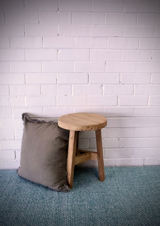 Chitose Round rustic stool. Handcrafted from durable, reclaimed teak, it adds a touch of rustic charm to any space and is built to last. Measures  350 Diameter X 460 Height. Styled.