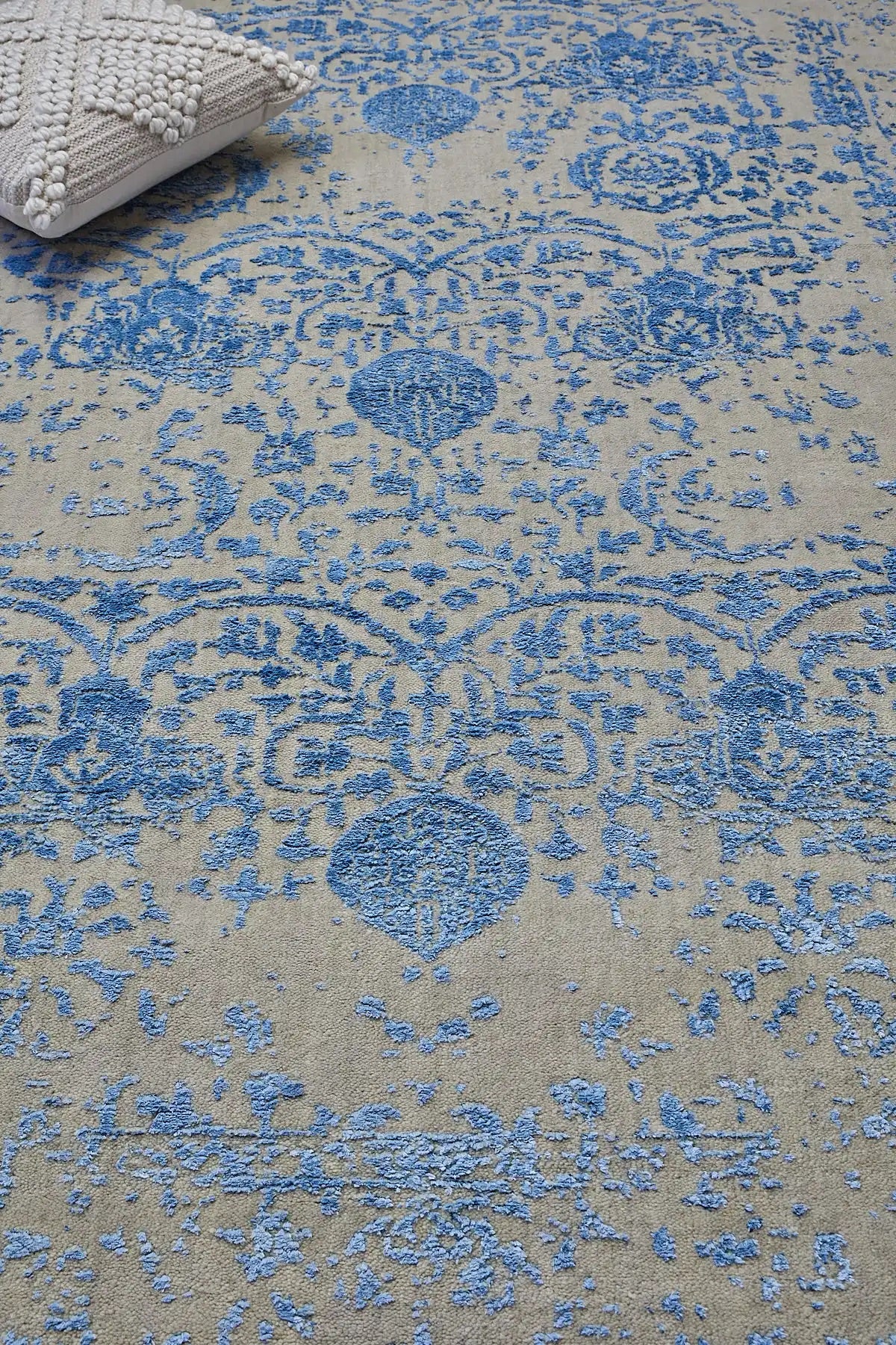 A close view of the Victoria Blue Viscose hand woven pile rug.