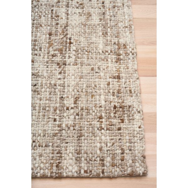 Cleo Brown hand-woven wool flatweave rug in a warm rust tone, with a flecked, cross-woven texture and flat woven border. 3 sizes. Corner view.