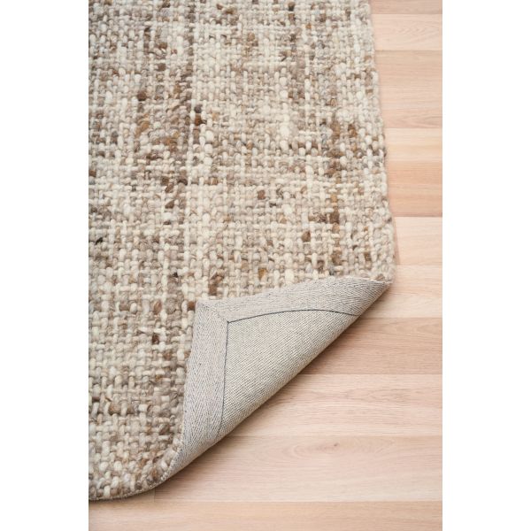 Cleo Brown hand-woven wool flatweave rug in a warm rust tone, with a flecked, cross-woven texture and flat woven border. 3 sizes. Fold view.