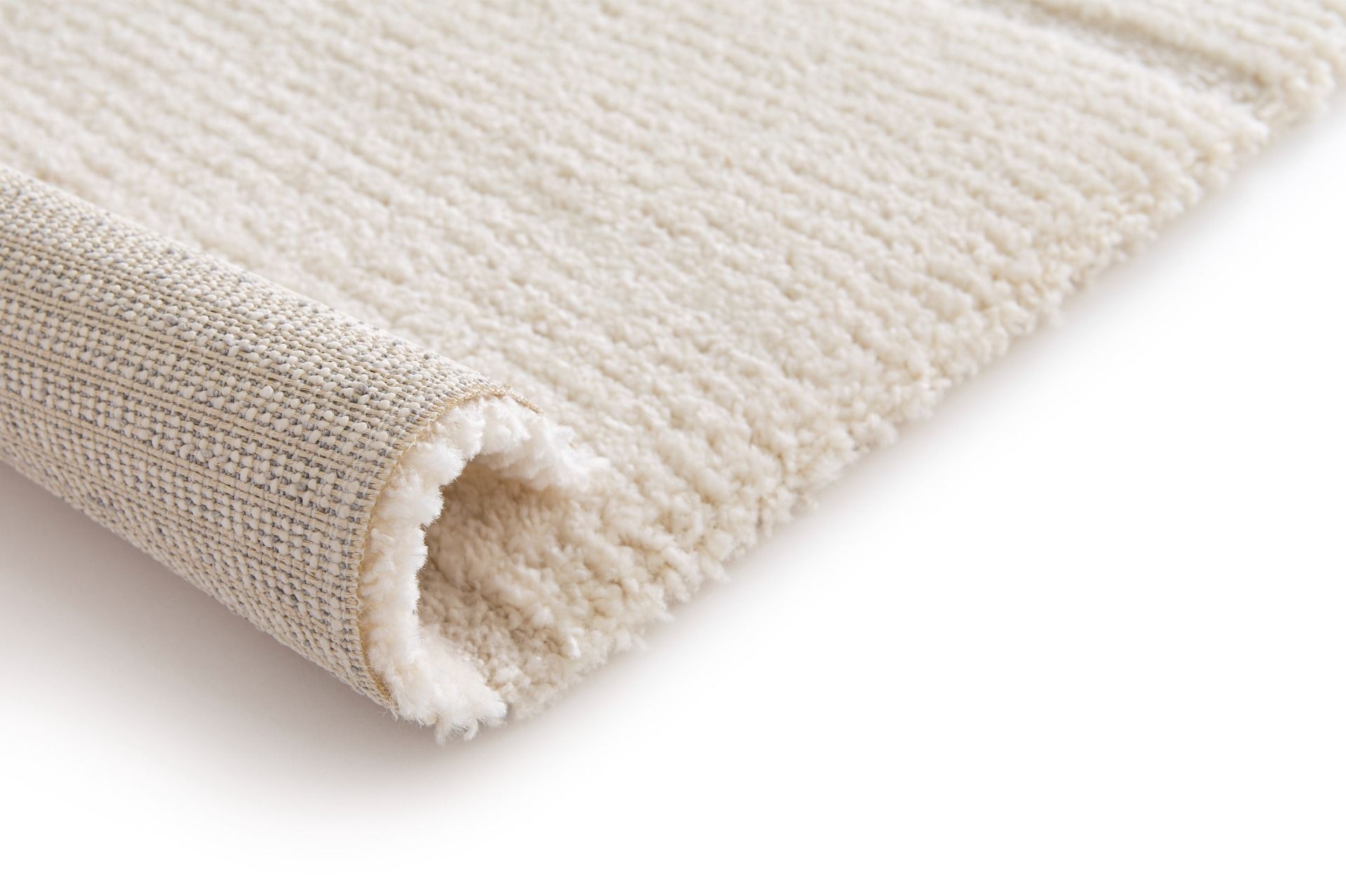 Cocoon - Cream, a modern rug design crafted with a unique blend of Heat Set Polypropylene and Polyester shrink yarn. Roll.