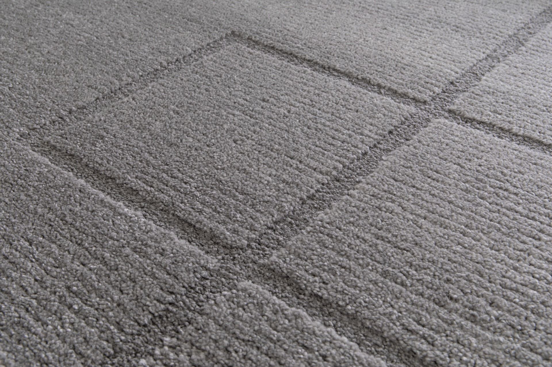 Cocoon - Grey, a modern rug design crafted with a unique blend of Heat Set Polypropylene and Polyester shrink yarn. Top Close.
