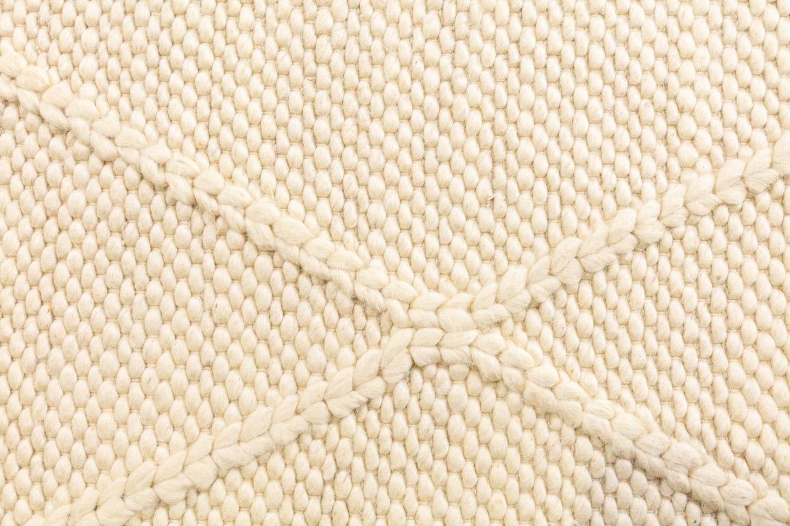 Colombo Cream is a textured hand woven rug. Made from 80% wool and 20% polyester, it features a braided diamond pattern for an extra textured feel.  Colour Cream.  Sizes 155 X 225, 200 X 290, 240 X 320 and 300 X 400. Close.