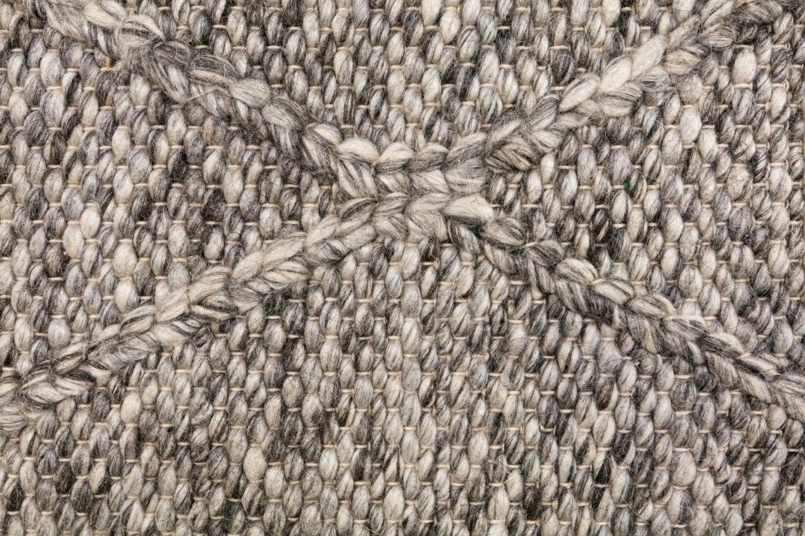 Colombo Dark Grey is a textured hand woven rug. Made from 80% wool and 20% polyester, it features a braided diamond pattern for an extra textured feel.  Colour Dark Grey.  Sizes 155 X 225, 200 X 290, 240 X 320 and 300 X 400. Close.