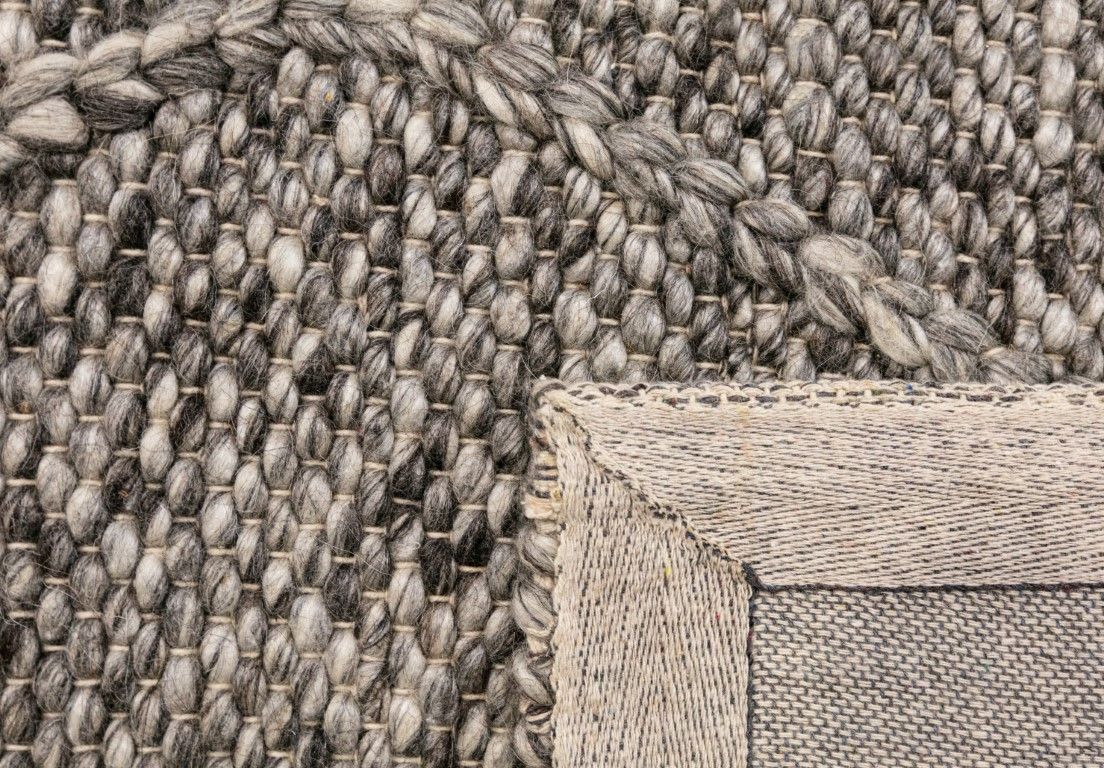 Colombo Dark Grey is a textured hand woven rug. Made from 80% wool and 20% polyester, it features a braided diamond pattern for an extra textured feel.  Colour Dark Grey.  Sizes 155 X 225, 200 X 290, 240 X 320 and 300 X 400. Fold.