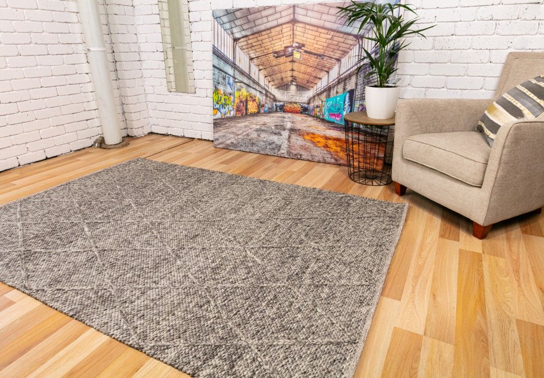 Colombo Dark Grey is a textured hand woven rug. Made from 80% wool and 20% polyester, it features a braided diamond pattern for an extra textured feel.  Colour Dark Grey.  Sizes 155 X 225, 200 X 290, 240 X 320 and 300 X 400. Life.