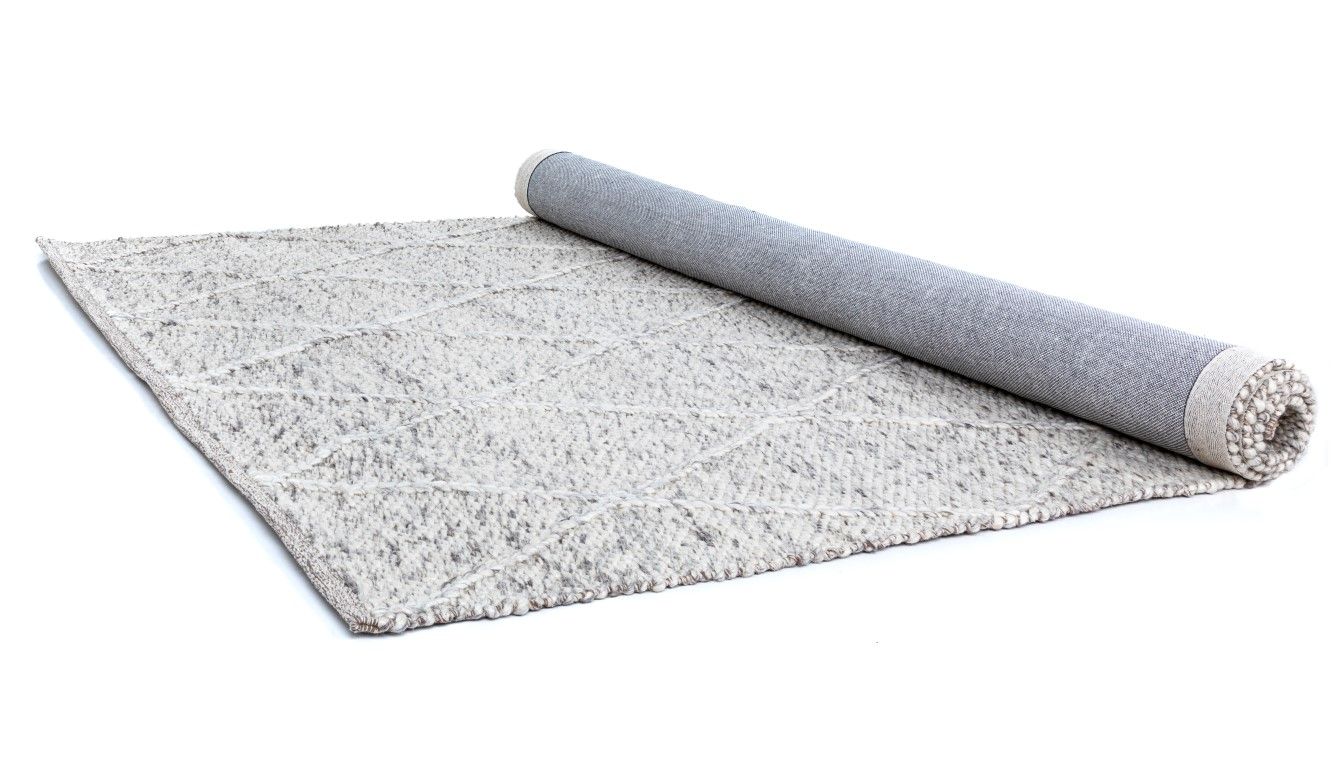 Colombo Light Grey is a textured hand woven rug. Made from 80% wool and 20% polyester, it features a braided diamond pattern for an extra textured feel.  Colour Light Grey.  Sizes 155 X 225, 200 X 290, 240 X 320 and 300 X 400. Half Roll.