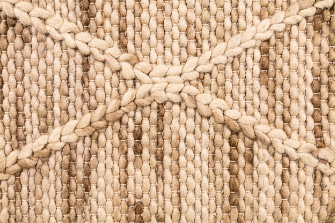 Colombo Natural is a textured hand woven rug. Made from 80% wool and 20% polyester, it features a braided diamond pattern for an extra textured feel.  Colour Creamy Beige with Brown accents.  Sizes 155 X 225, 200 X 290, 240 X 320 and 300 X 400. Close.