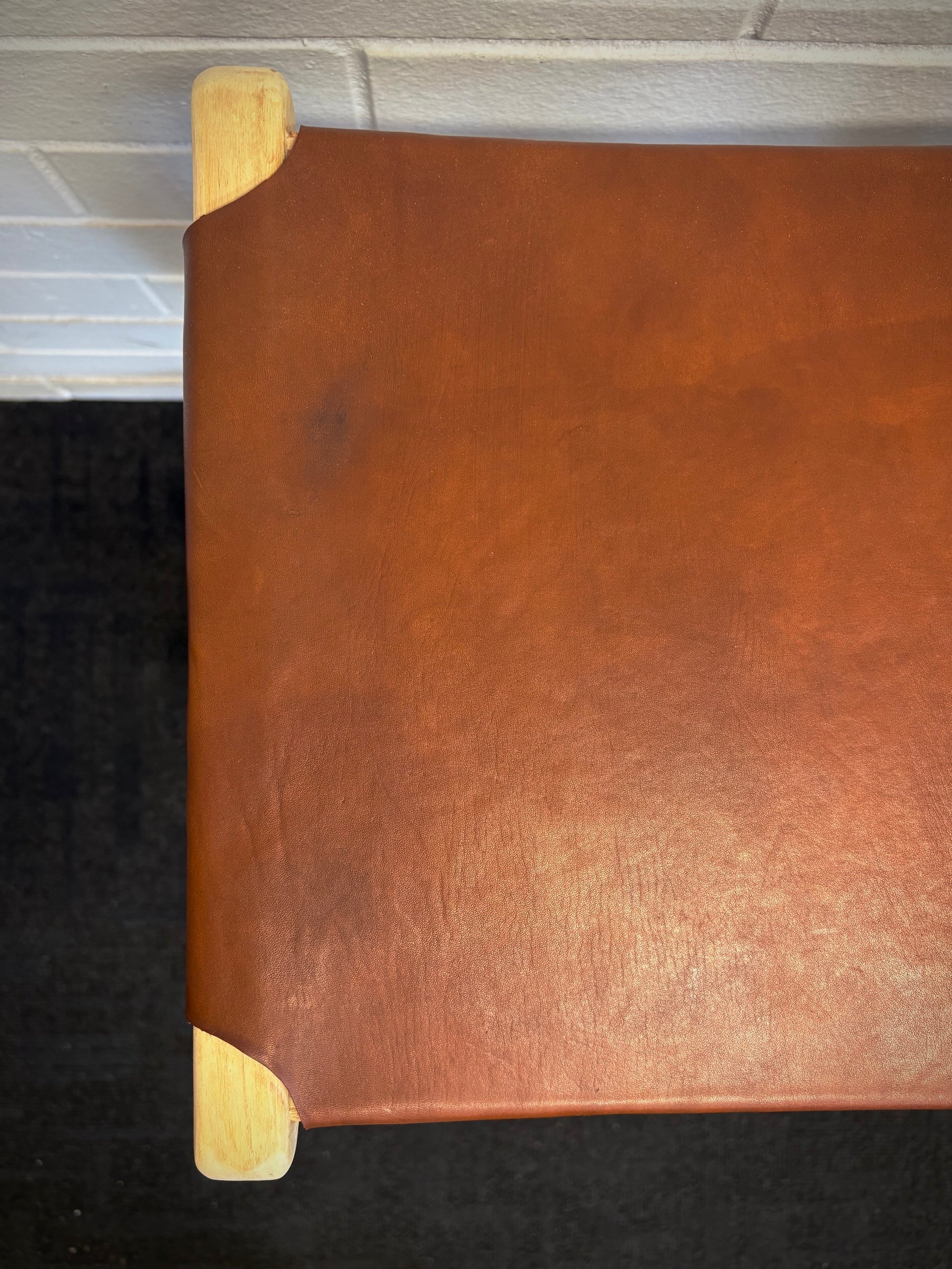 The Columbia - Brown Leather barstool features a lush leather seat and sustainable teak framed legs. Colour natural teak frame with brown leather seat. Measures 400 wide X 400 depth X 650 Seat height. Top.