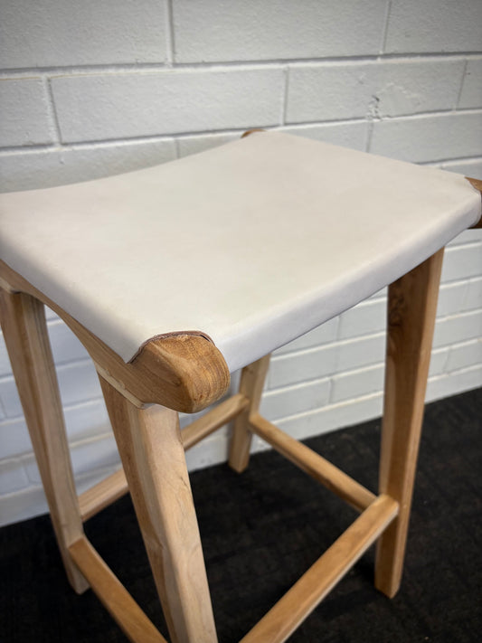 The Columbia - White Leather barstool features a lush leather seat and sustainable teak framed legs. Colour natural teak frame with white seat. Measures 400 wide X 400 depth X 650 Seat height. Angle.