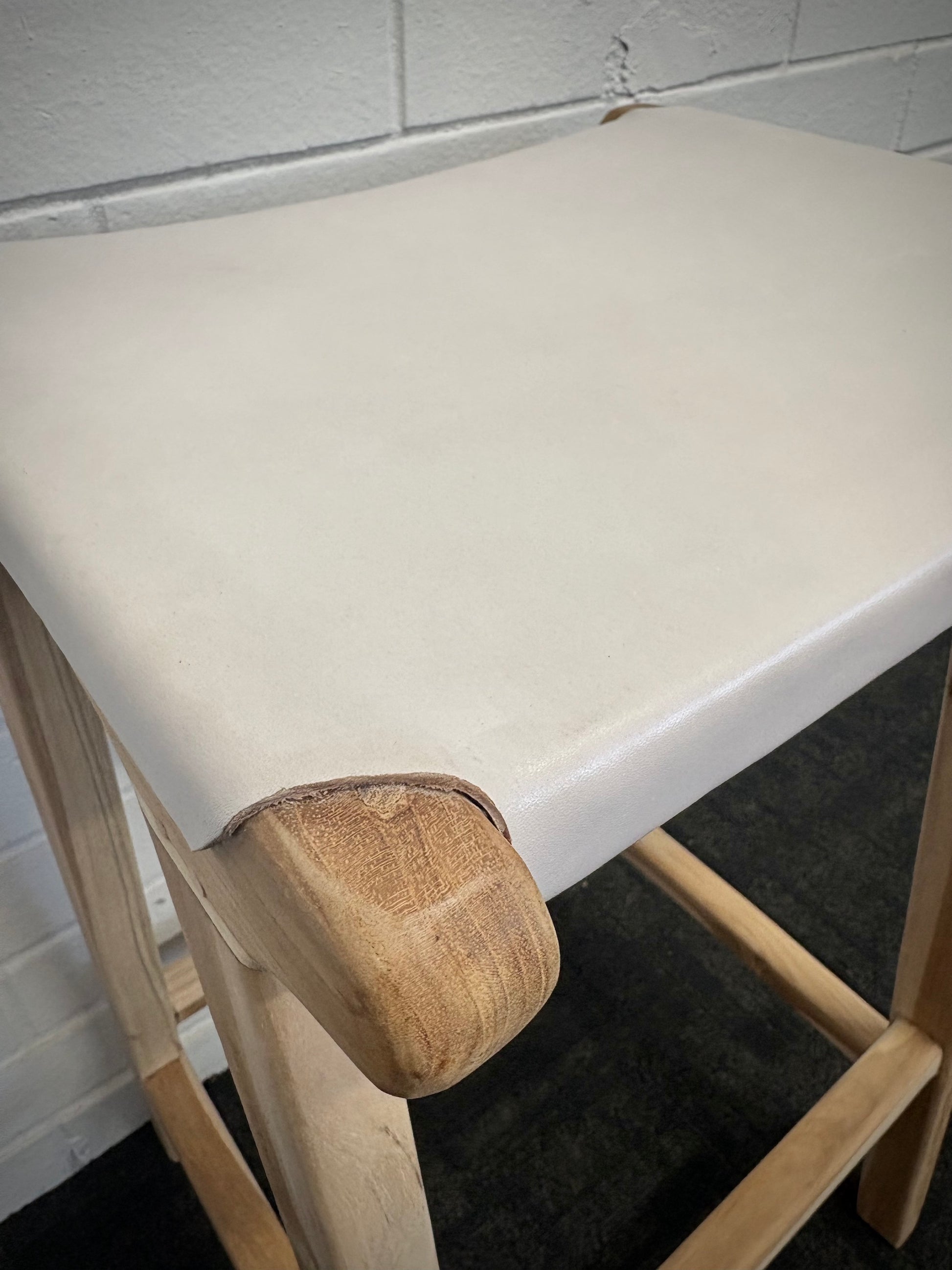 The Columbia - White Leather barstool features a lush leather seat and sustainable teak framed legs. Colour natural teak frame with white seat. Measures 400 wide X 400 depth X 650 Seat height. Close.