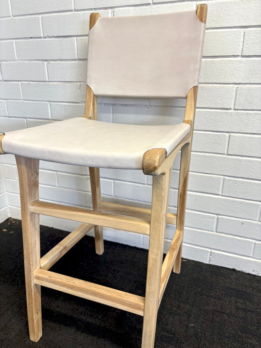 The Columbia with Back - White Leather barstool features a white leather seat and back with sustainable teak framed legs. Colour natural teak frame with white leather seat and back. Measures 400 wide X 400 depth X 680 Seat height X 1000 Back height. Angle.