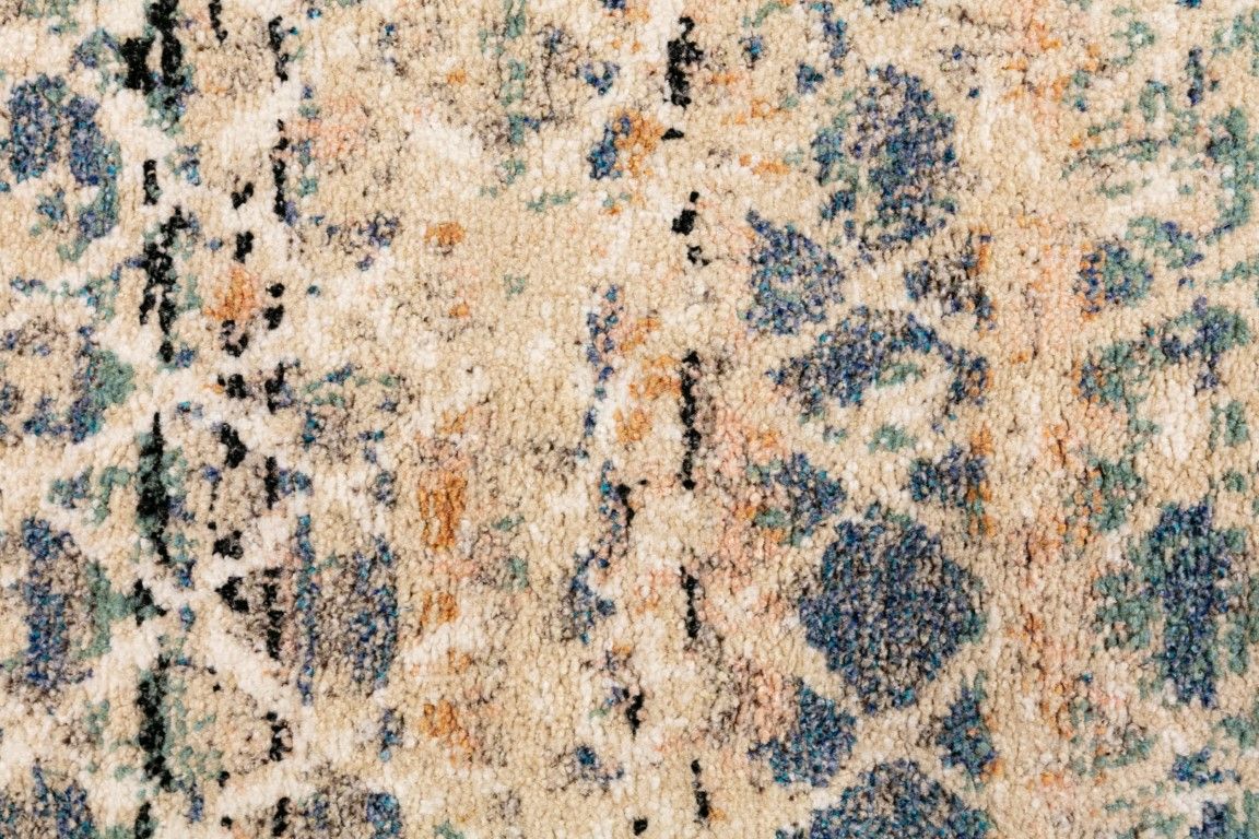 Cozy 5422 Blue Beige is a tribal designed machine made rug. Constructed from luxurious polyester yarn, it features a soft feel.  Colours Beige with Cream, Blue and Black patterns. Size 160 X 230. Close.