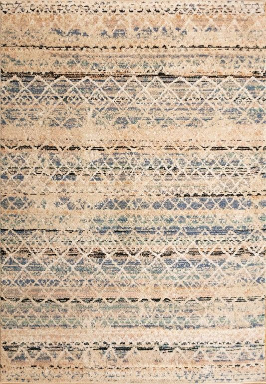 Cozy 5422 Blue Beige is a tribal designed machine made rug. Constructed from luxurious polyester yarn, it features a soft feel.  Colours Beige with Cream, Blue and Black patterns. Sizes  160 X 230 and 200 X 290. Full.