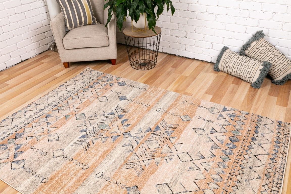 Cozy 5425 Rust Dark Beige is a tribal patterned designed machine made rug. Constructed from luxurious polyester yarn, it features a soft feel. Colours Rust and Dark Beige with Cream and Black and Blue Diamond Patterns. Sizes 160 X 230, 200 X 290, 240 X 320 and 300 X 400. Life.