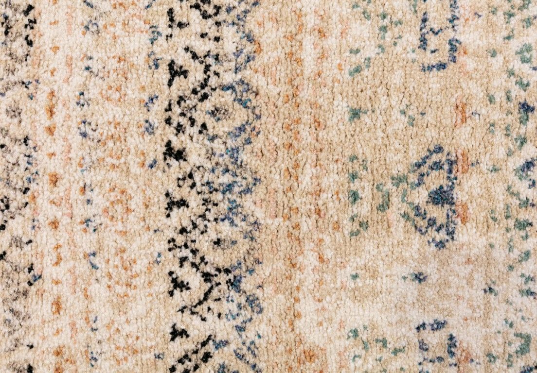 Cozy 5426 Ivory Beige is a tribal patterned designed machine made rug. Constructed from luxurious polyester yarn, it features a soft feel.  Colours Beige with Cream, Blue and Black Tribal Patterns. Size 160 X 230, 200 X 290 and 300 X 400. Close.