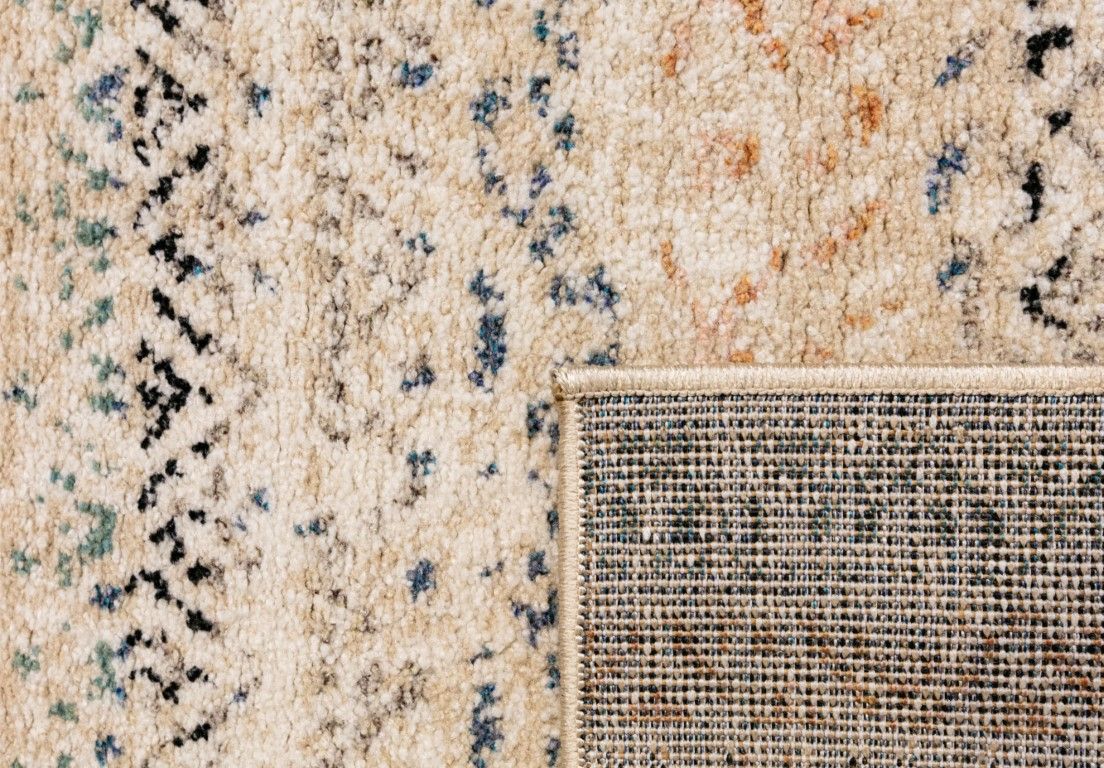Cozy 5426 Ivory Beige is a tribal patterned designed machine made rug. Constructed from luxurious polyester yarn, it features a soft feel.  Colours Beige with Cream, Blue and Black Tribal Patterns. Size 160 X 230, 200 X 290 and 300 X 400. Fold.