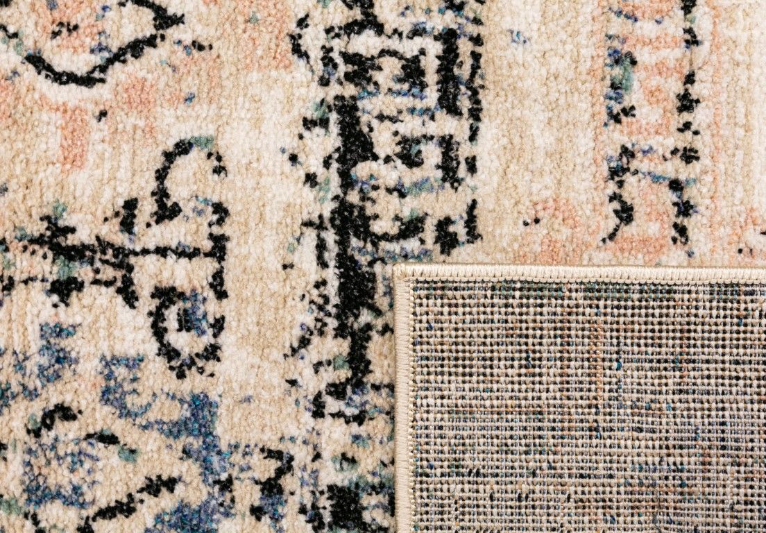 Cozy 5434 Ivory Beige is a tribal patterned designed machine made rug. Constructed from luxurious polyester yarn, it features a soft feel.  Colours  Ivory Beige with Cream, Black and Blue Tribal Patterns. Size 160 X 230 and 200 X 290. Fold.