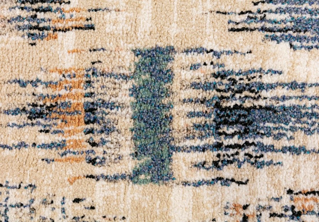 Cozy 5439 Blue Beige is a tribal diamond patterned designed machine made rug. Constructed from luxurious polyester yarn, it features a soft feel.  Colours Beige with Cream, Blue and Black Diamond Patterns. Sizes  160 X 230 and 200 X 290 and 300 X 400. Close.
