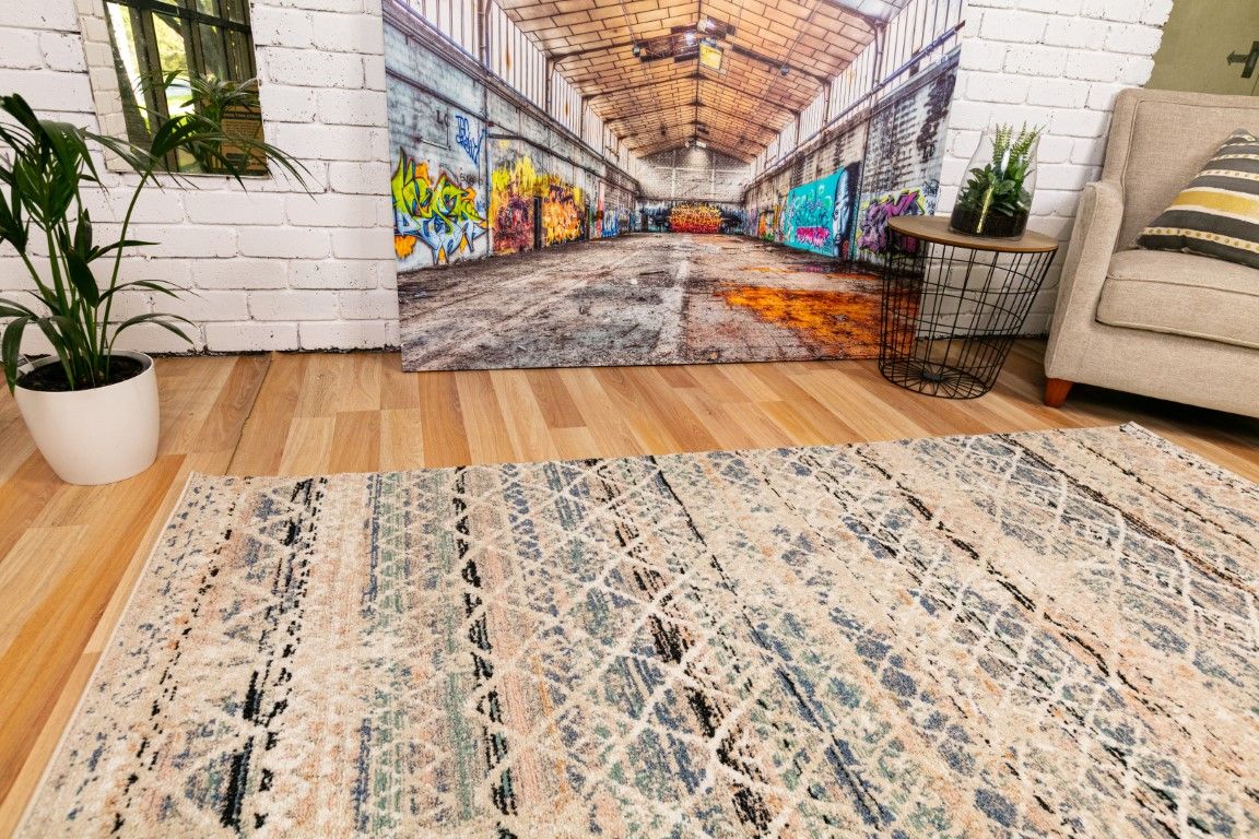 Cozy 5422 Blue Beige is a tribal designed machine made rug. Constructed from luxurious polyester yarn, it features a soft feel.  Colours Beige with Cream, Blue and Black patterns. Size 160 X 230. Life.