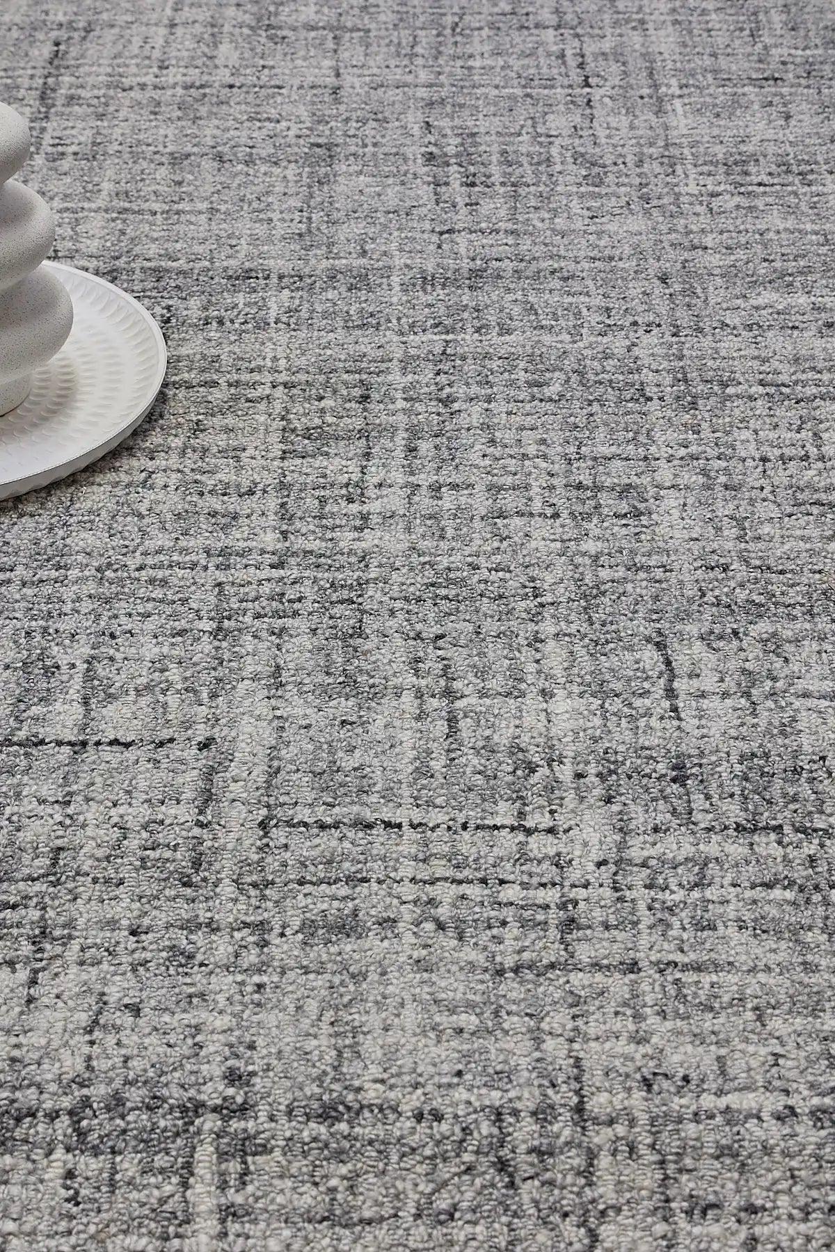 Crown - Black is a Modern/Contemporary textured hand tufted Wool and Polyester rug with a pile height of 12-14mm. Colours Light Grey with Black and Grey accents. Sizes 160 X 230, 200 X 290, and 240 X 340. Life