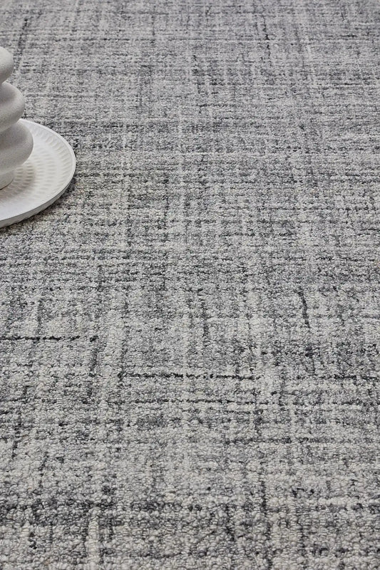Crown - Black is a Modern/Contemporary textured hand tufted Wool and Polyester rug with a pile height of 12-14mm. Colours Light Grey with Black and Grey accents. Sizes 160 X 230, 200 X 290, and 240 X 340. Life