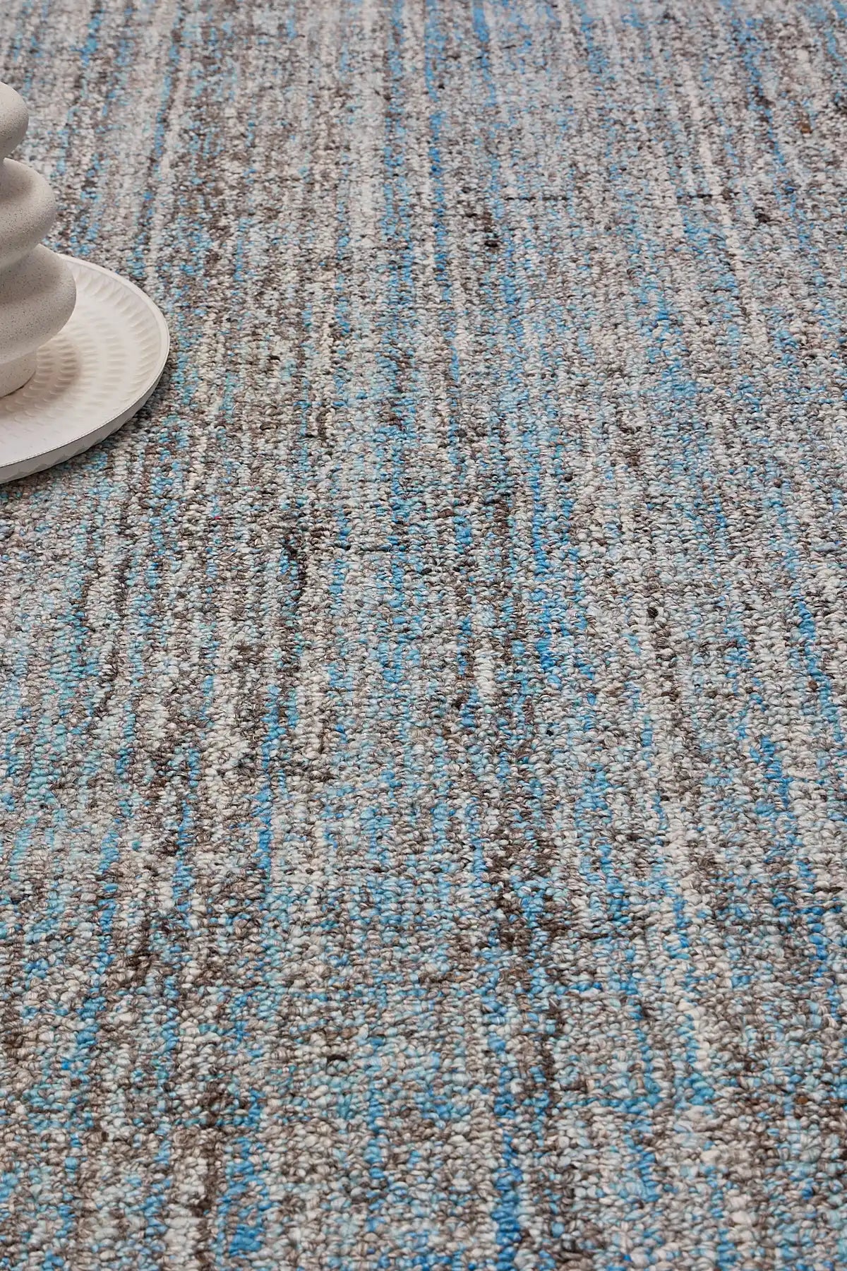 Crown - Blue is a Modern/Contemporary textured hand tufted Wool and Polyester rug with a pile height of 12-14mm. Colours Blue with Dark Grey and Grey accents. Sizes 160 X 230, 200 X 290, and 240 X 340. Life