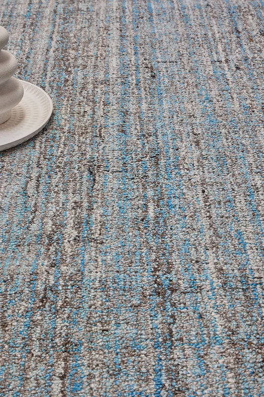 Crown - Blue is a Modern/Contemporary textured hand tufted Wool and Polyester rug with a pile height of 12-14mm. Colours Blue with Dark Grey and Grey accents. Sizes 160 X 230, 200 X 290, and 240 X 340. Life