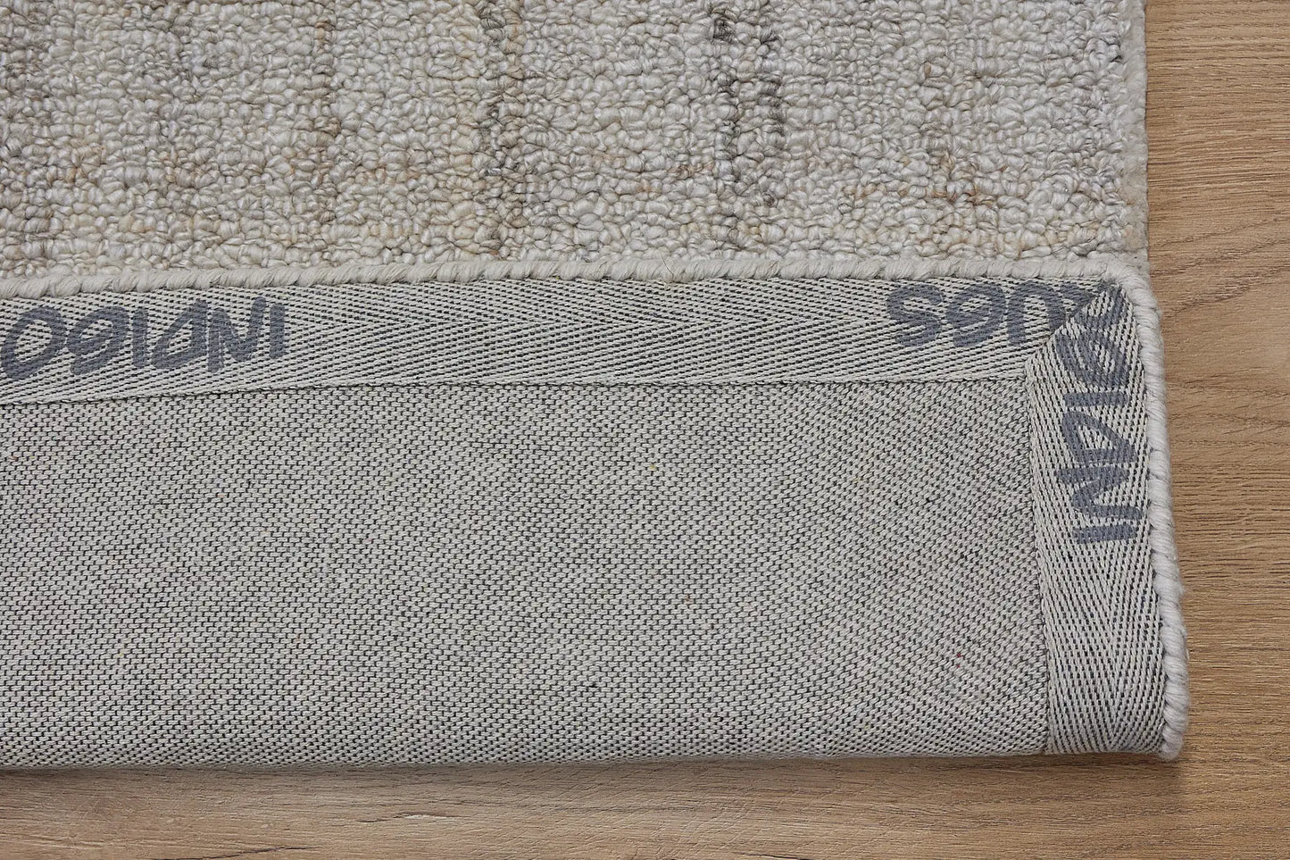 Crown - Ivory is a Modern/Contemporary textured hand tufted Wool and Polyester rug with a pile height of 12-14mm. Colours Ivory with Beige accents. Sizes 160 X 230, 200 X 290, and 240 X 340. Fold.