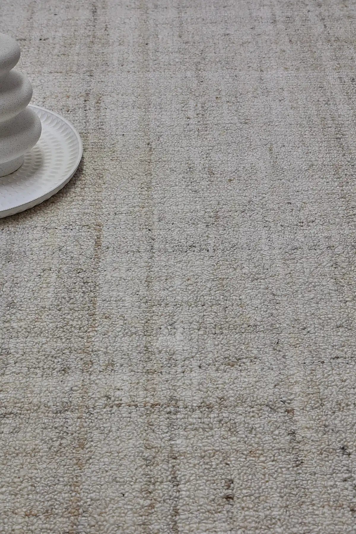 Crown - Ivory is a Modern/Contemporary textured hand tufted Wool and Polyester rug with a pile height of 12-14mm. Colours Ivory with Beige accents. Sizes 160 X 230, 200 X 290, and 240 X 340. Life.