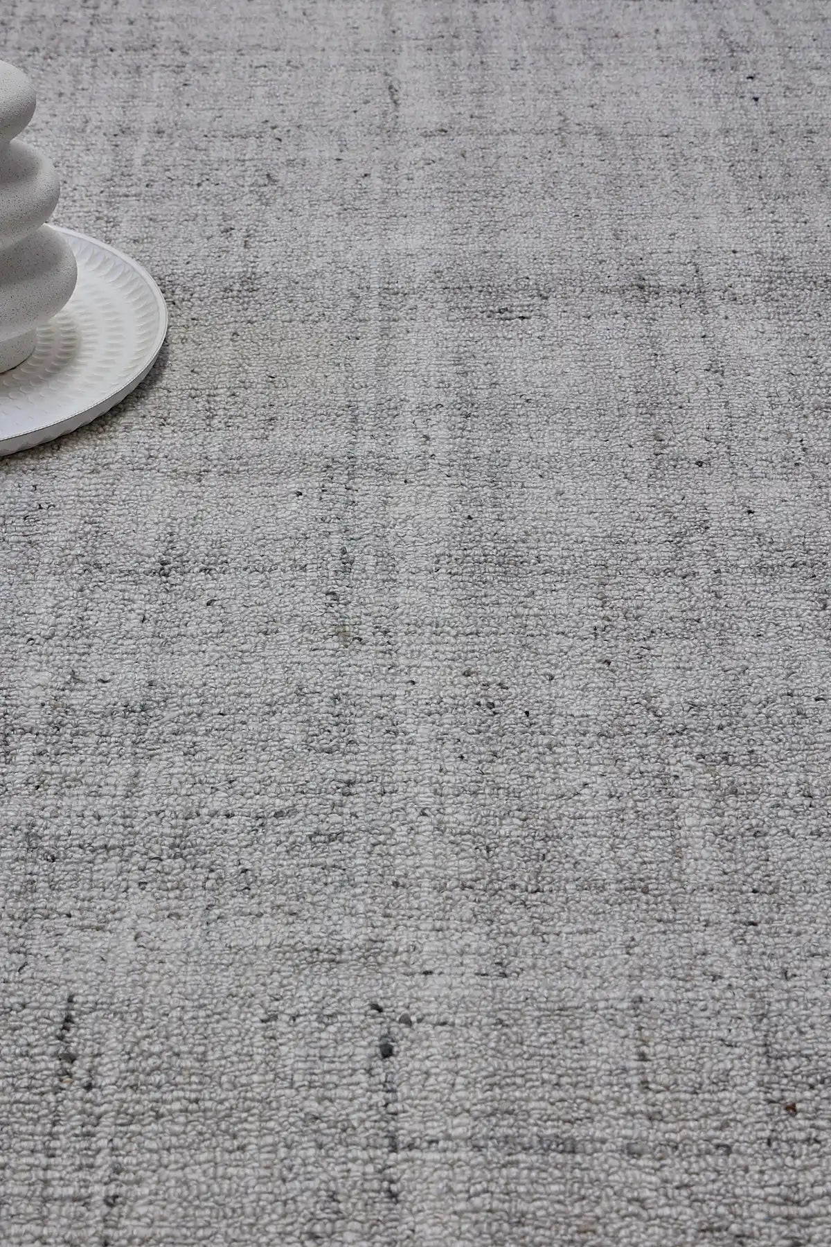 Crown - Light Grey is a Modern/Contemporary textured hand tufted Wool and Polyester rug with a pile height of 12-14mm. Colours Light Grey with Grey accents. Sizes 160 X 230, 200 X 290, and 240 X 340. Life.